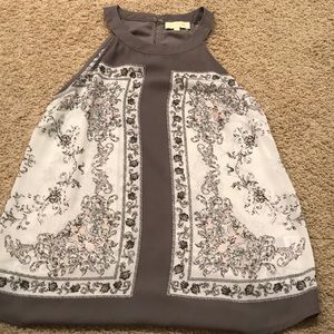 A grey tank top blouse